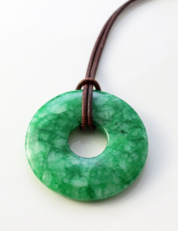 jade necklace - bright green jade donut pendant on brown leather .