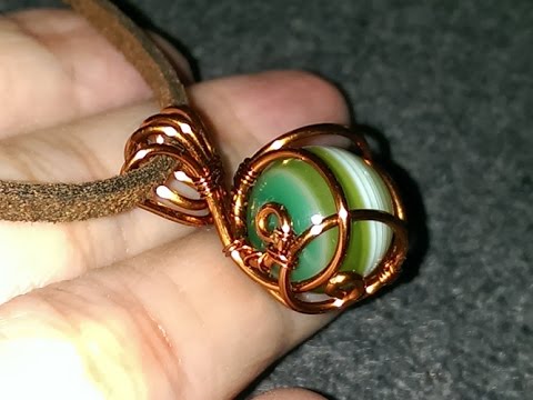 How to make wire jewelry - Wire wrapped spherical stone pendants .