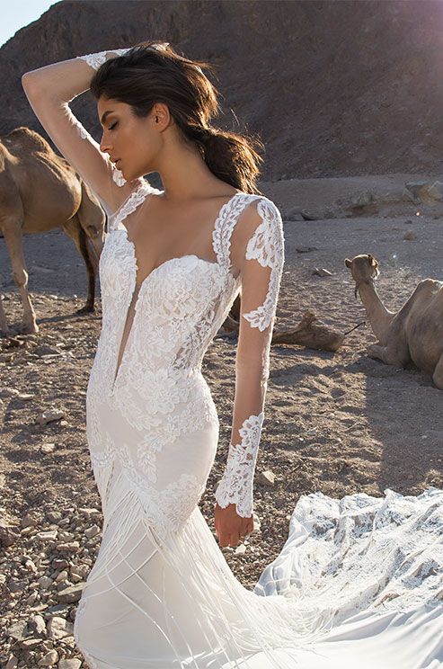 An off white chiffon fit-and-flare with embroidered corded lace .